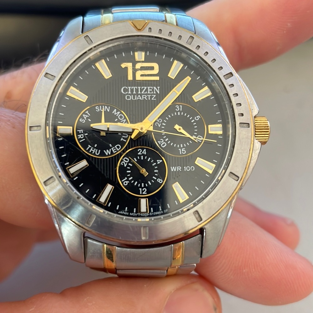 Citizen watch, steel and brass strap.